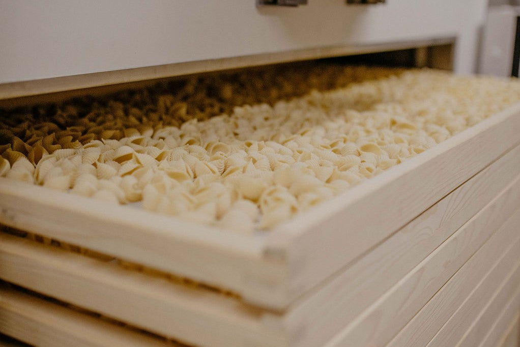 Pasta drying on wooden racks