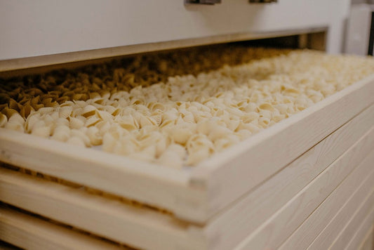 Pasta drying on wooden racks